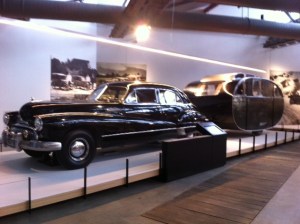 Huge American car pulling a 1950s homemade caravan (a very impressive transport section)