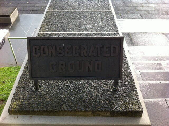 Sign outside the museum saying Consecrated Ground