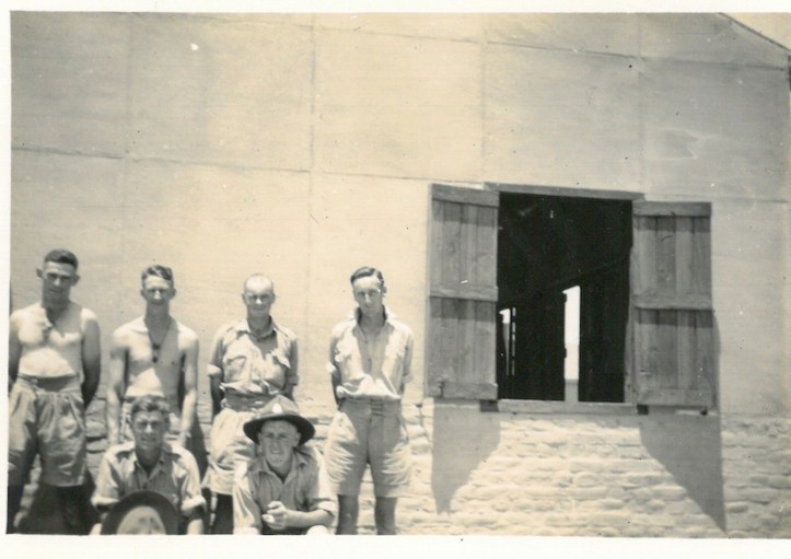 Boys outside hut at Maadi