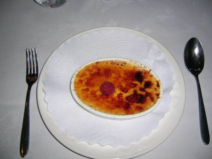 Creme Brulee with seasonal berry (singular)