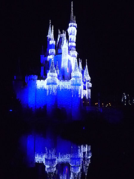Cinderella's Castle at the Magic Kingdom is lit up at night with lights to look like icicles - so pretty!