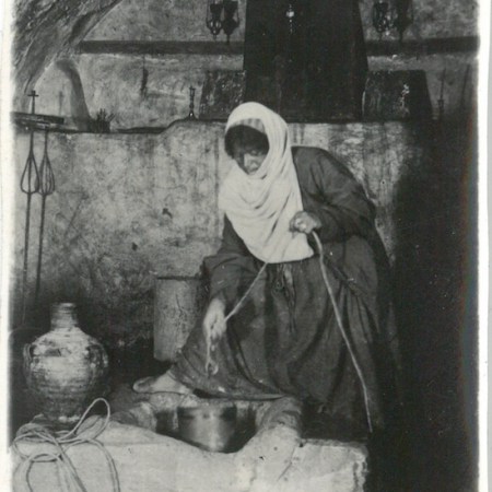 Native woman drawing water from Mary's Well - Nazareth